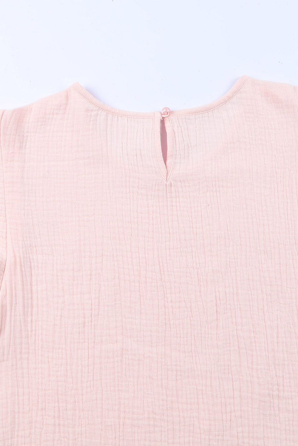 Blusa de manga corta con volantes escalonados y textura rosa