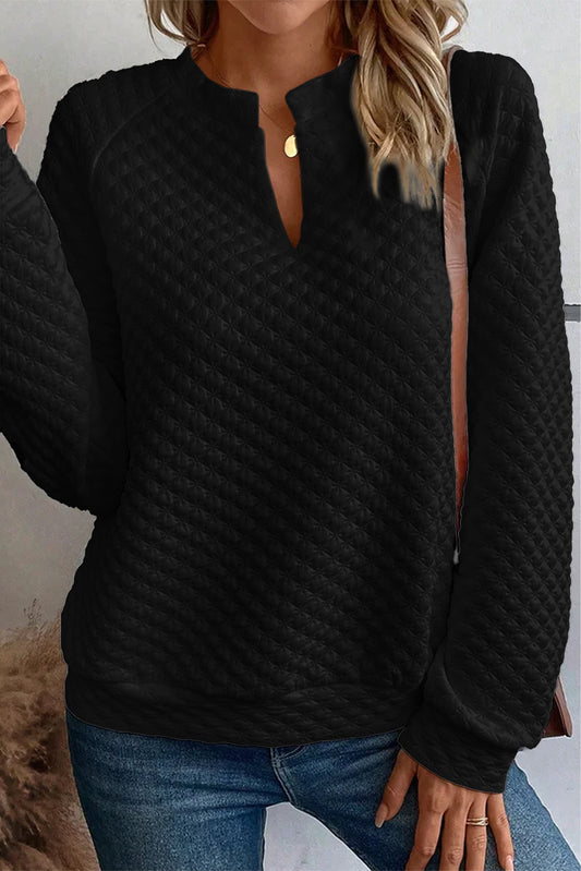 Top de manga larga acolchado con cuello dividido negro