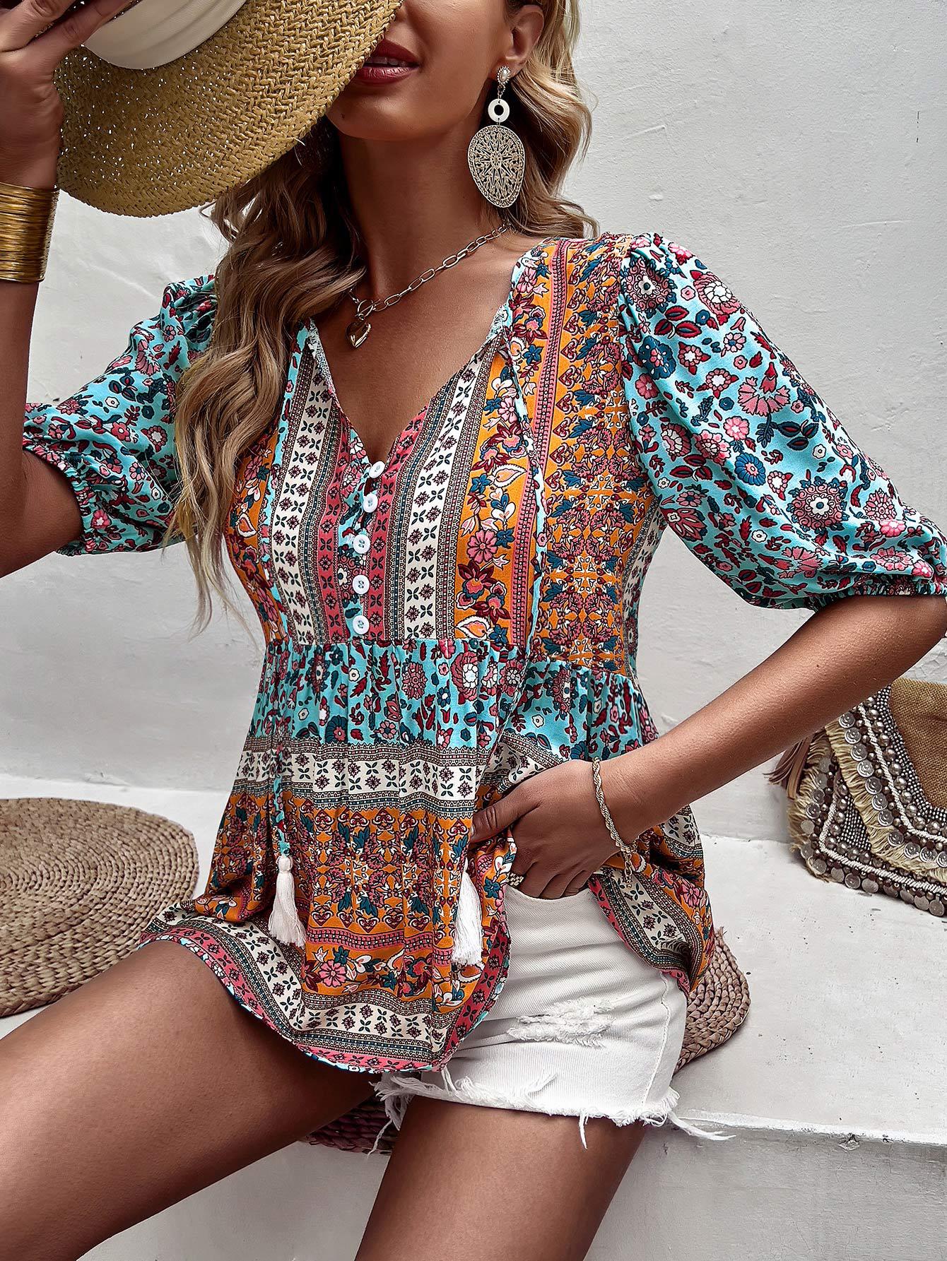 Blusa babydoll con mangas abullonadas y lazo con borlas bohemias