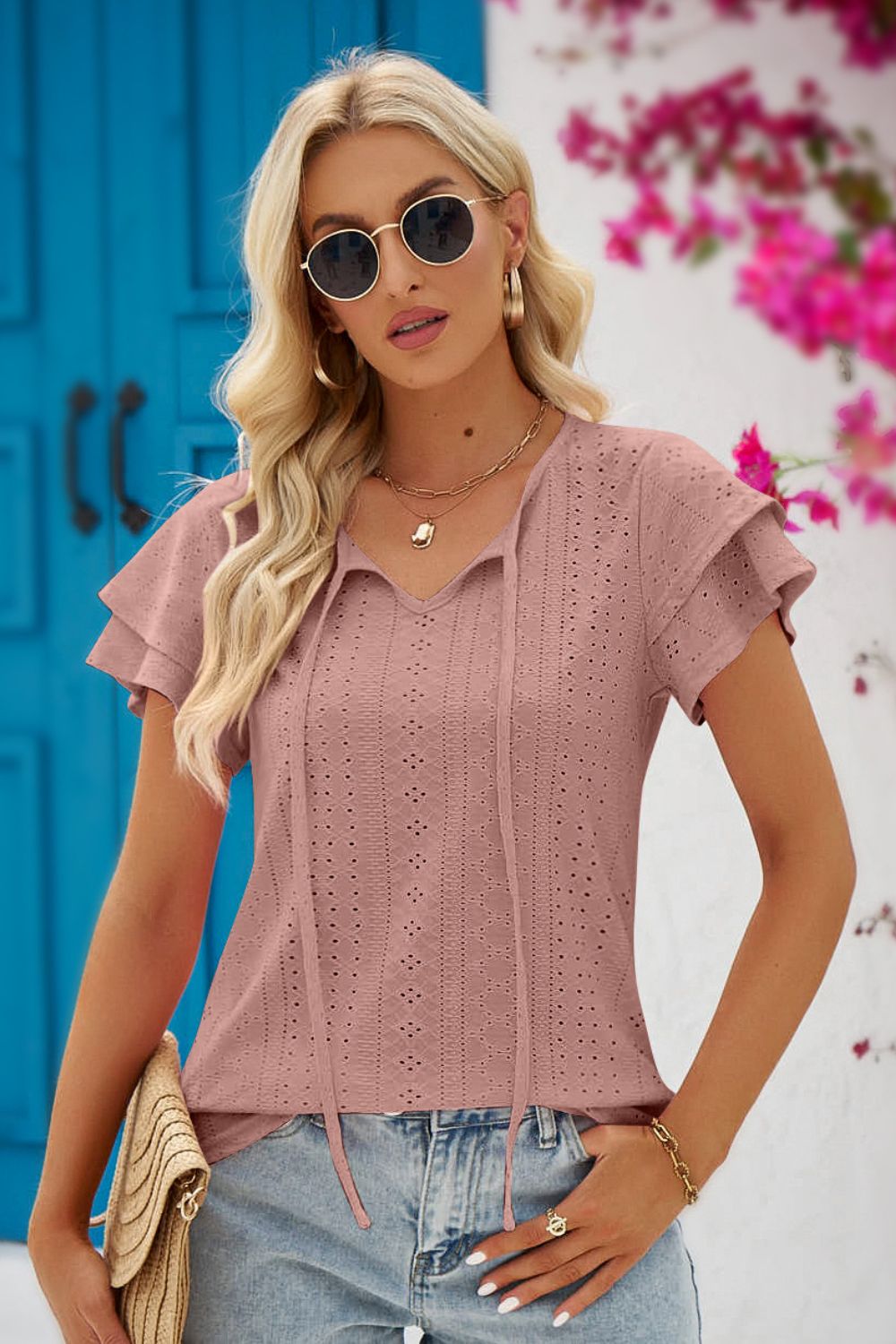 Blouse à manches flottantes et col noué à œillets