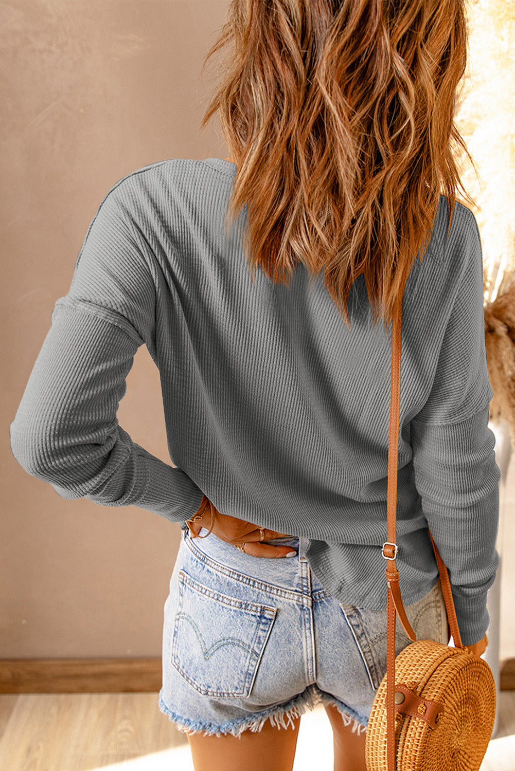 Top de manga larga con cuello henley y punto waffle