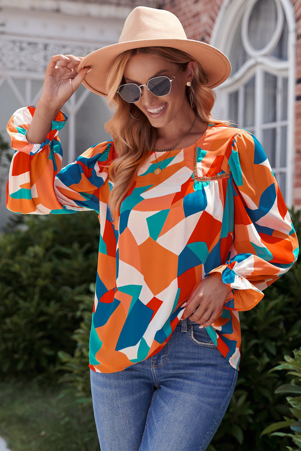 Blouse à manches bouffantes et à volants à col rond et motif abstrait