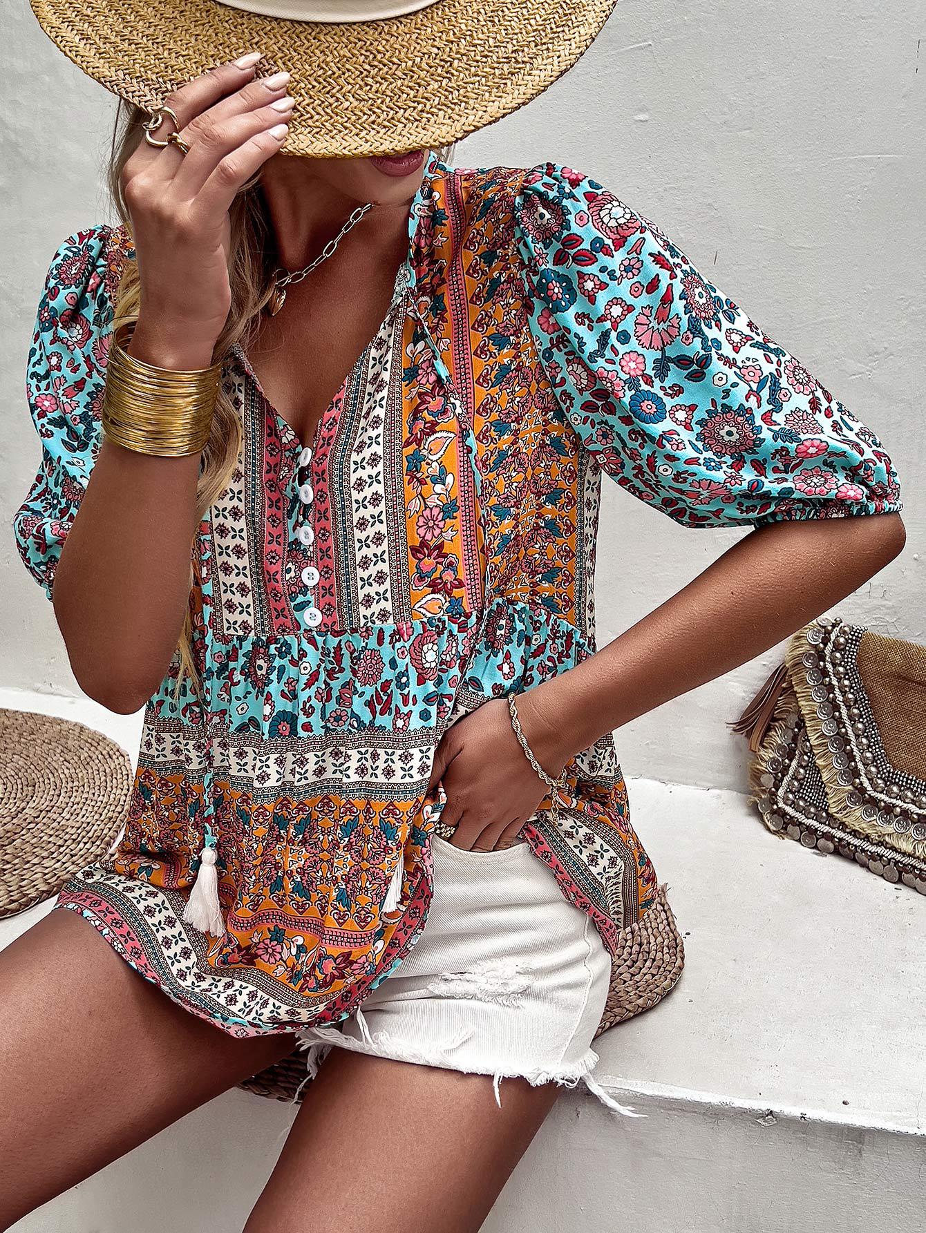 Blusa babydoll con mangas abullonadas y lazo con borlas bohemias