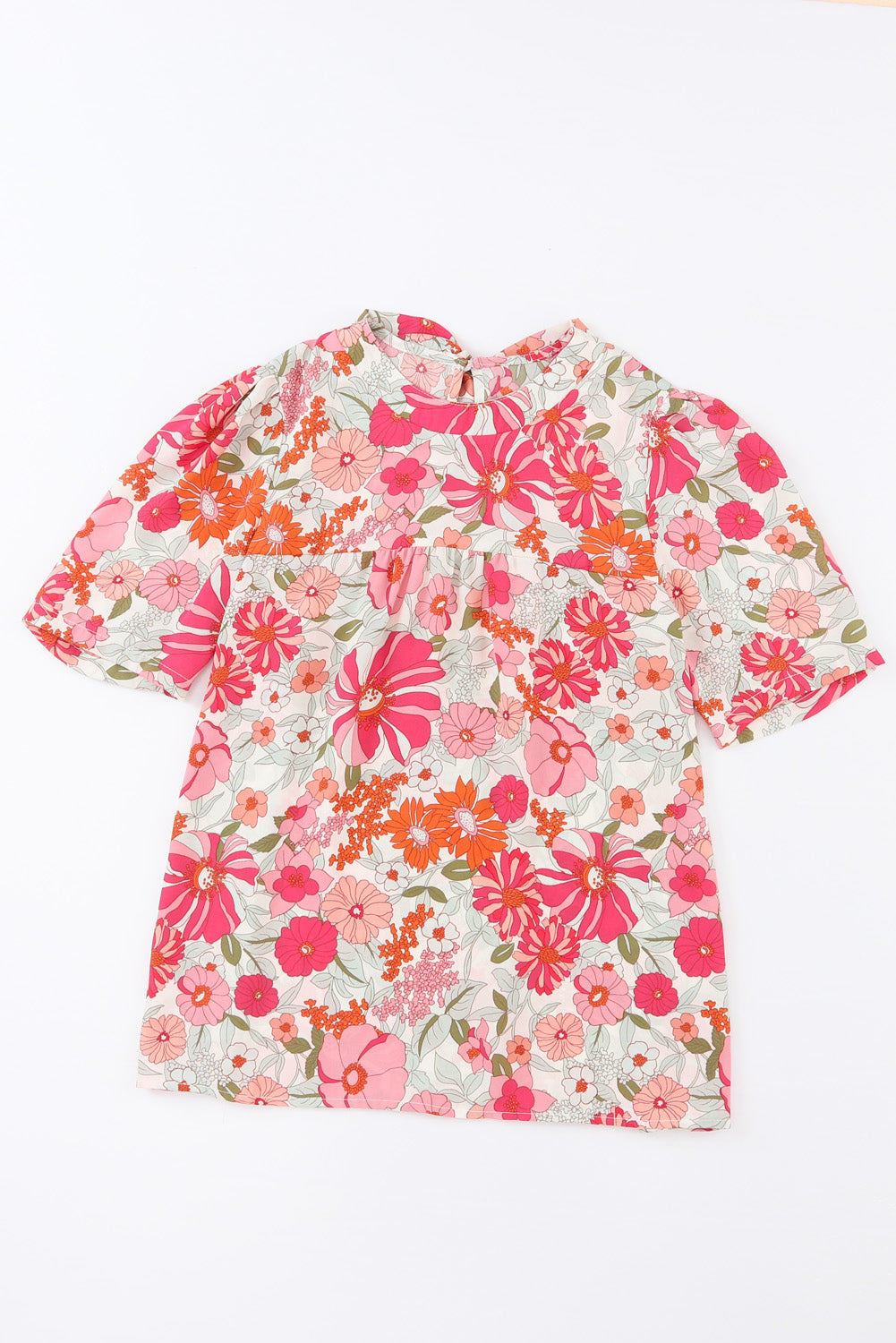 Blusa floral con mangas abullonadas y anudada