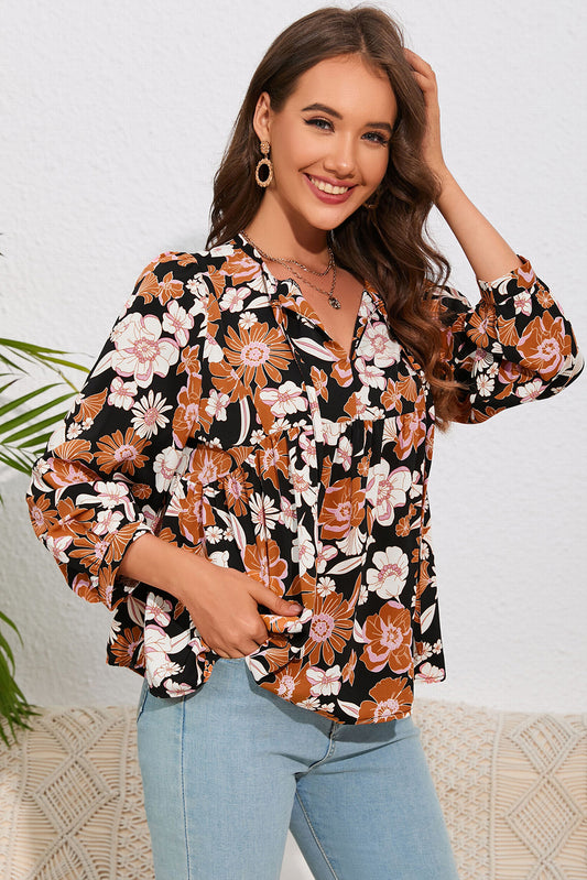 Blusa babydoll con cuello anudado y flores