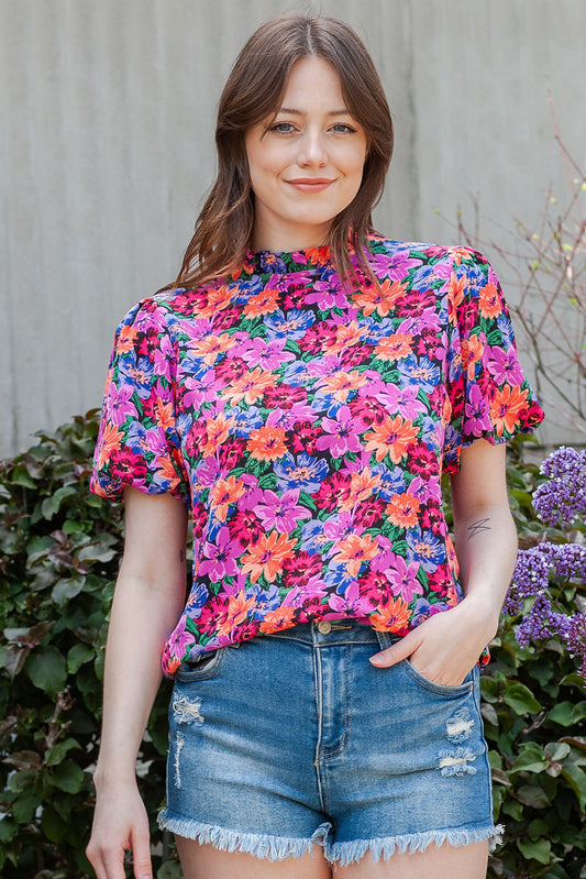 Blusa con cuello redondo y manga abullonada con estampado floral